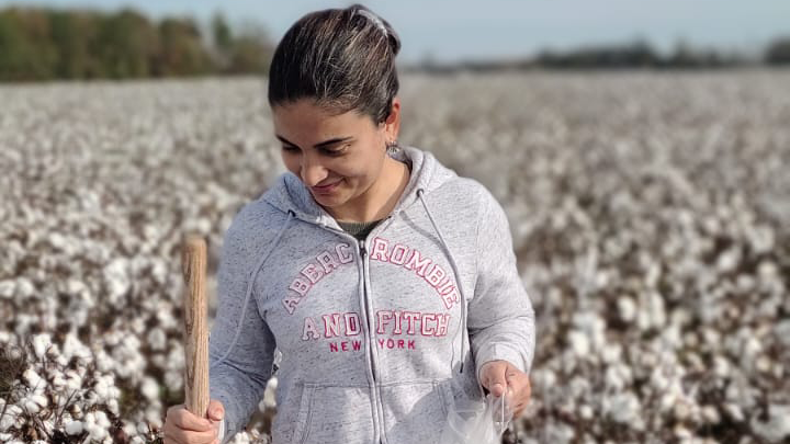 Woman in cotton field